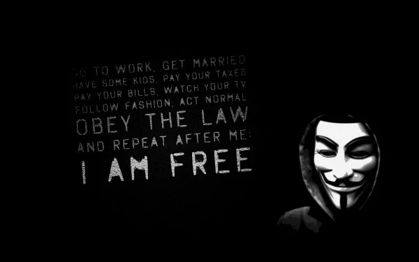 A dark HD wallpaper featuring a masked figure alongside the text urging rebellion against societal norms, boldly declaring I AM FREE. Anarchy themes dominate the design.