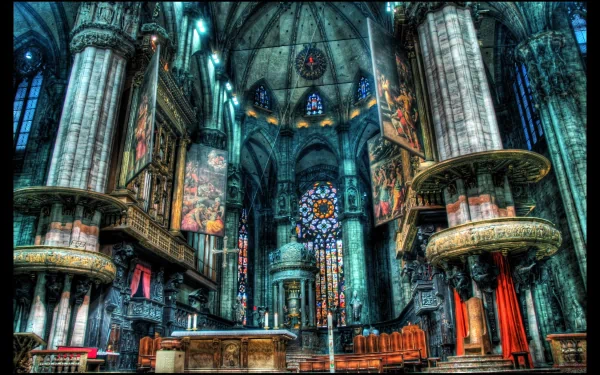 HD PC desktop wallpaper showcasing the intricate interior of a grand religious cathedral with stained glass windows and detailed stone architecture.