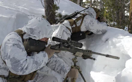 U.S. Army Infantry snipers in white camouflage gear aiming rifles in a snowy forest, depicted in a high-definition military desktop wallpaper.