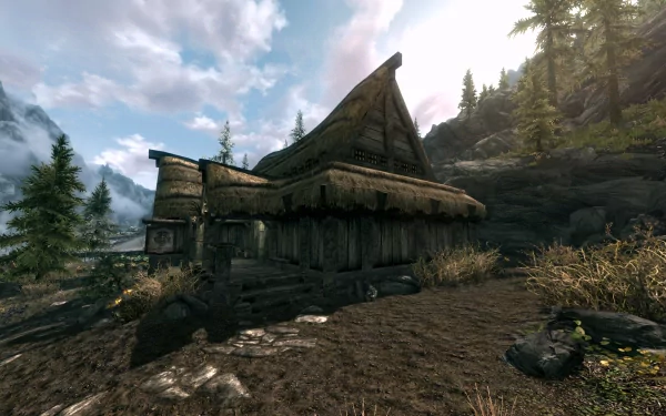HD PC desktop wallpaper from The Elder Scrolls V: Skyrim showing a Falkreath thatched cabin among pine trees and rocky hills beneath a cloudy sky.