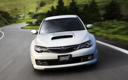 White Subaru Impreza vehicle on a winding mountain road — Subaru HD PC desktop wallpaper and background.