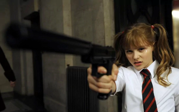 HD PC desktop wallpaper featuring a scene from the movie Kick-Ass with a girl aiming a gun, emphasizing the Girls & Guns theme.