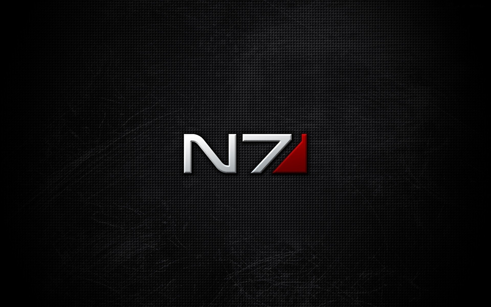 A sleek HD PC desktop wallpaper featuring the iconic N7 logo from the Mass Effect video game, set against a dark, textured background that enhances its striking design.