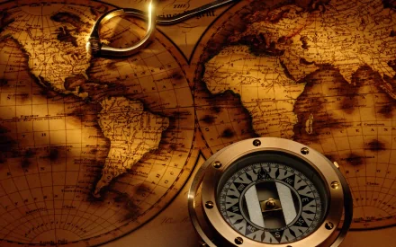 HD PC desktop wallpaper featuring a vintage sepia-toned world map with a brass compass resting on its surface.