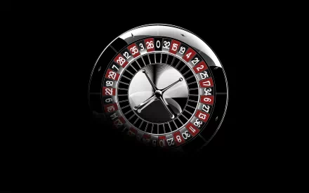 A sleek casino roulette wheel dominates this HD PC wallpaper, set against a dark background, capturing the thrill of gaming and entertainment.