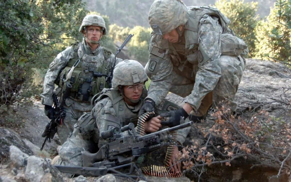HD desktop wallpaper featuring three soldiers in full military gear operating a machine gun in a forested outdoor setting.