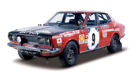 HD PC desktop wallpaper and background showing a red vintage racing vehicle, sports car, number 9, with sponsor decals on a white backdrop.