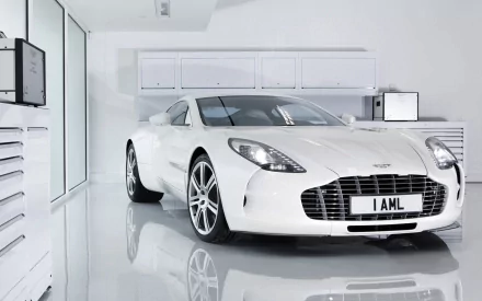 White Aston Martin One-77 parked in a glossy minimalist garage, high-resolution HD PC desktop wallpaper and background.