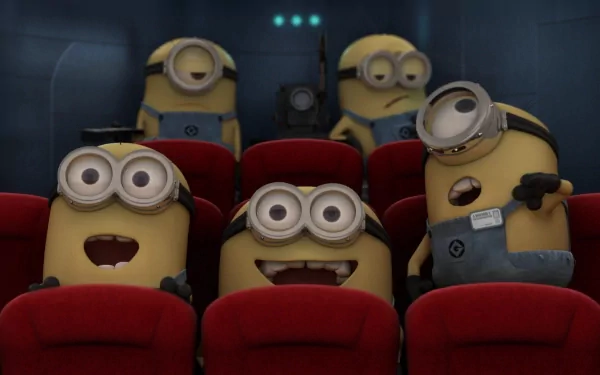 HD PC desktop wallpaper featuring Minions from the movie Despicable Me sitting and reacting in a theater setting.