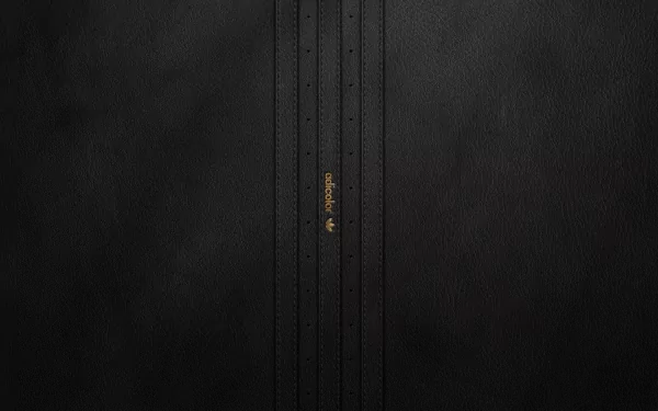 A sleek HD desktop wallpaper featuring a textured black background with subtle vertical stripes and an Adidas logo, embodying a modern, minimalist aesthetic.