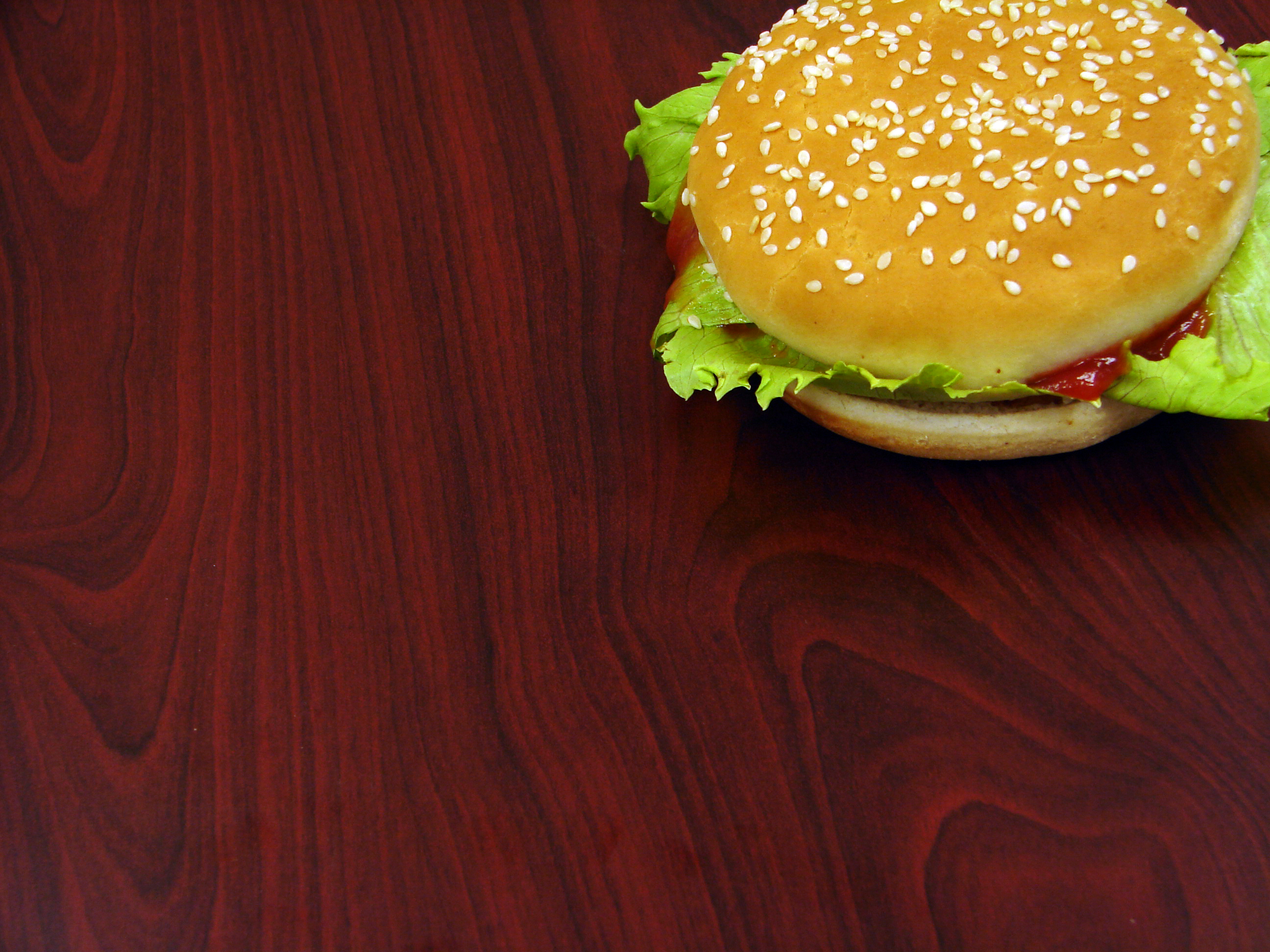 Delicious hamburger on a vibrant desktop wallpaper.