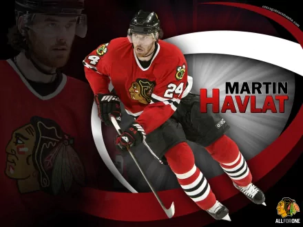 HD desktop wallpaper featuring Martin Havlat in Chicago Blackhawks hockey gear, captured mid-action against a dynamic red, black, and white sports-themed background.