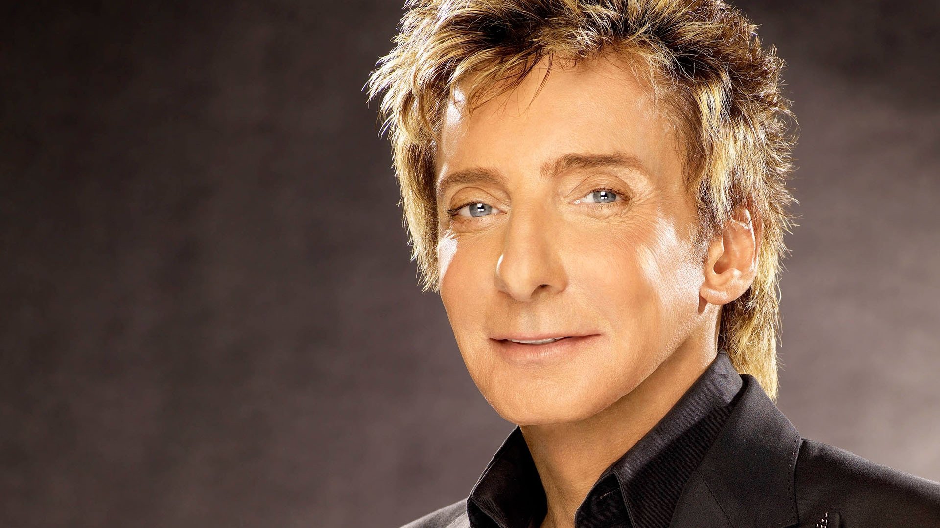 HD desktop wallpaper featuring a close-up portrait of Barry Manilow, highlighting his classic style and musical legacy.