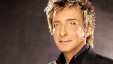 HD desktop wallpaper featuring a close-up portrait of Barry Manilow, highlighting his classic style and musical legacy.