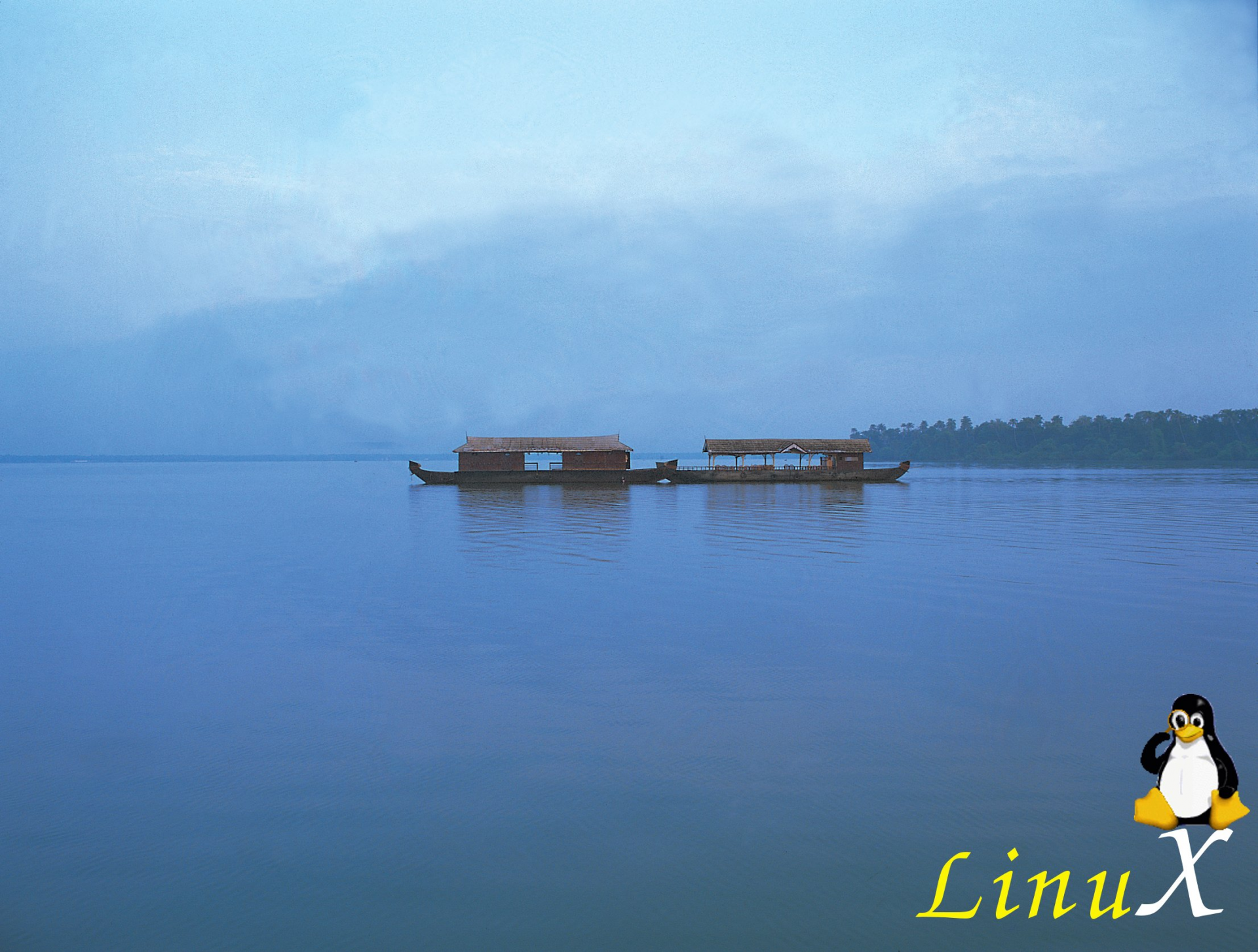 HD desktop wallpaper featuring a calm blue water scene with two houseboats, blending Ubuntu, technology, and Linux themes in a serene digital background.