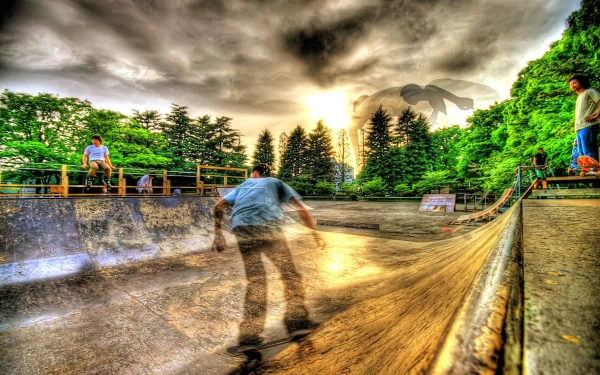 A vibrant HD wallpaper showcasing a skateboarder in motion at a park, surrounded by lush greenery and spectators, capturing the excitement of skateboarding sports.