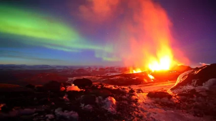 A striking HD image of a volcano erupting, surrounded by snow and illuminated by vibrant auroras in the night sky, capturing the raw beauty of nature.
