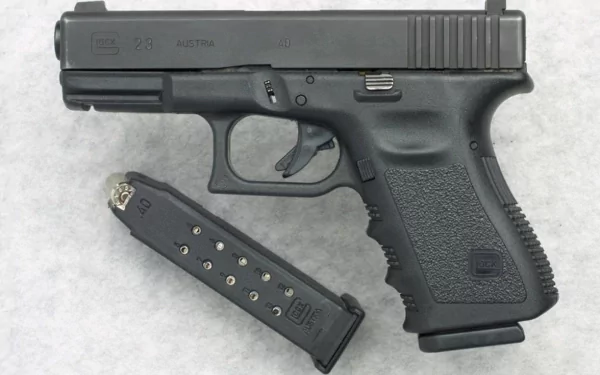An HD desktop wallpaper featuring a Glock pistol and a detached magazine on a light background.