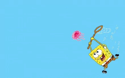 SpongeBob SquarePants joyfully chasing a jellyfish, set against a bright blue background, makes a vibrant HD wallpaper for fans of the beloved TV show.
