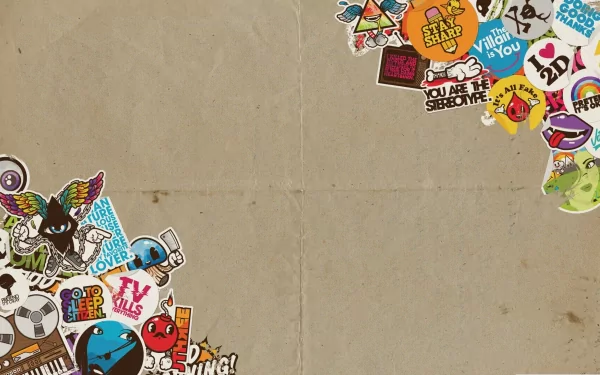 HD PC desktop wallpaper featuring a man-made sticker bomb design with colorful, overlapping stickers arranged in the corners on a textured beige background.