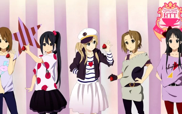 A vibrant HD wallpaper featuring characters from the anime K-ON! The group is playfully posing with strawberries against a striped background, capturing the lively spirit of the series.