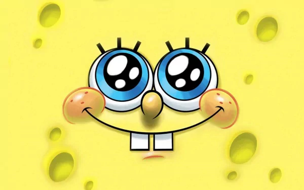 HD desktop wallpaper featuring the cheerful face of SpongeBob SquarePants from the TV show. Bright yellow background with SpongeBob's blue eyes and characteristic smile.