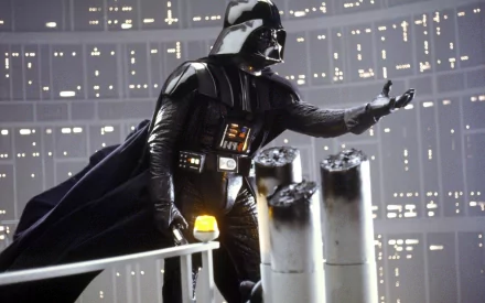 Darth Vader from Star Wars stands menacingly, showcasing his iconic armor and lightsaber, set against the backdrop of the Death Star in Star Wars Episode V: The Empire Strikes Back.