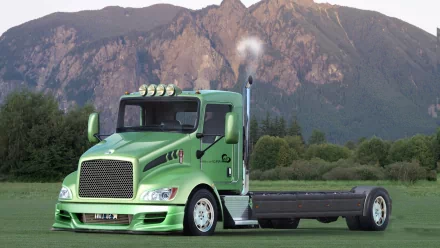 HD desktop wallpaper featuring a green truck parked in front of a mountainous landscape under a clear sky.