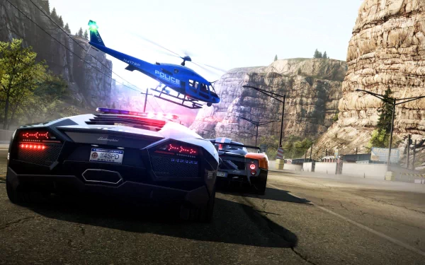 An action-packed HD wallpaper from Need For Speed: Hot Pursuit, featuring sleek sports cars and a police helicopter, set against a dramatic rocky landscape.