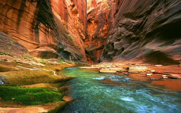 A breathtaking view of the Grand Canyon, showcasing vibrant rock formations and a serene river. This stunning nature scene makes a captivating HD desktop wallpaper.