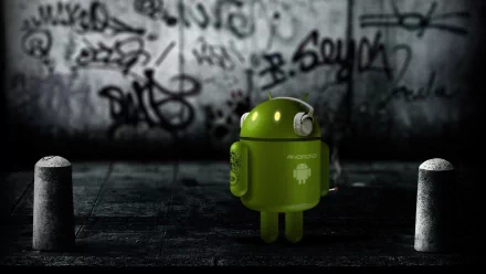 HD PC desktop wallpaper featuring the green Android robot mascot standing in a dark urban setting with graffiti-covered walls, highlighting technology and Android themes.
