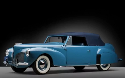 A vintage blue Lincoln car with a soft top, showcasing classic design elements. This HD image serves as an evocative desktop wallpaper, highlighting automotive elegance from the past.