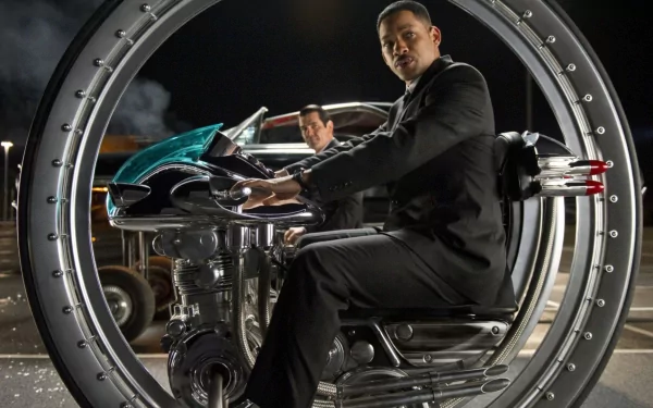 Movie HD PC desktop wallpaper from Men In Black 3: two agents in black suits ride a futuristic single-wheel motorcycle on a dark street under a night sky.