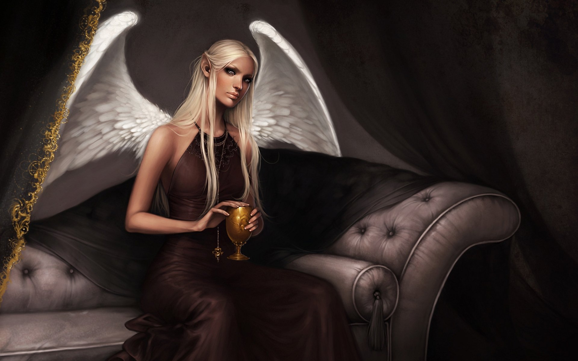 A mystical angel sits elegantly on a plush sofa, holding a golden chalice, with delicate white wings and a serene expression, set against a rich, dark backdrop. Fantasy HD wallpaper.
