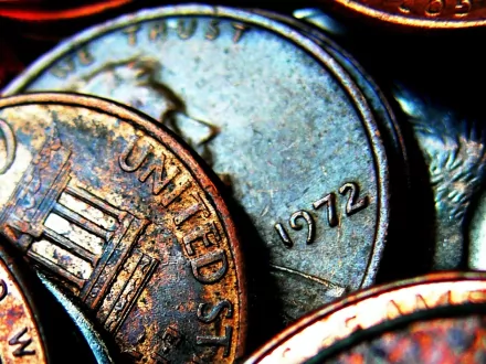 Close-up of vintage coins featuring United States and the year 1972, showcasing intricate textures and colors. A high-definition desktop wallpaper capturing man-made currency details.