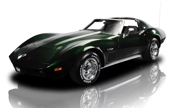 HD PC desktop wallpaper background: dark green Chevrolet sports car with chrome wheels reflected on a glossy white studio surface.