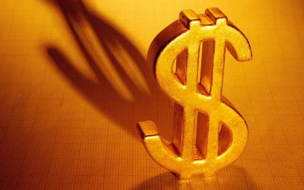 A striking HD desktop wallpaper featuring a gleaming gold dollar sign, casting a distinct shadow against a warm background, symbolizing wealth and prosperity.