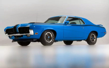 HD desktop wallpaper featuring a classic blue Mercury vehicle by Ford, showcasing its vintage muscle car design against a clean, neutral background.