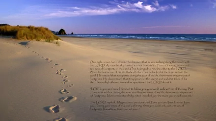 HD desktop wallpaper featuring footprints in the sand with a religious, Christian theme. Text over the image conveys a message about walking with the Lord. Serene beach scene with gentle waves.