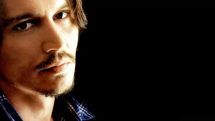 HD desktop wallpaper featuring Johnny Depp against a dark background.
