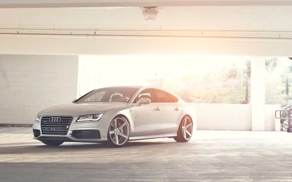 HD PC desktop wallpaper featuring a sleek silver Audi parked in a bright, spacious indoor setting.