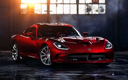 HD desktop wallpaper featuring a sleek red Dodge SRT Viper GTS parked indoors with dramatic lighting highlighting its aggressive design.