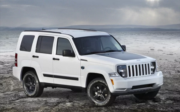 A white Jeep parked on a rugged landscape, showcasing its sleek design and off-road capabilities. This HD image serves as an engaging desktop wallpaper and background.