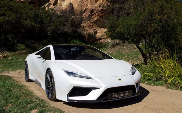 White Lotus sports car parked on a dirt path amid rocks and trees — HD PC desktop wallpaper and background of a sleek vehicle.