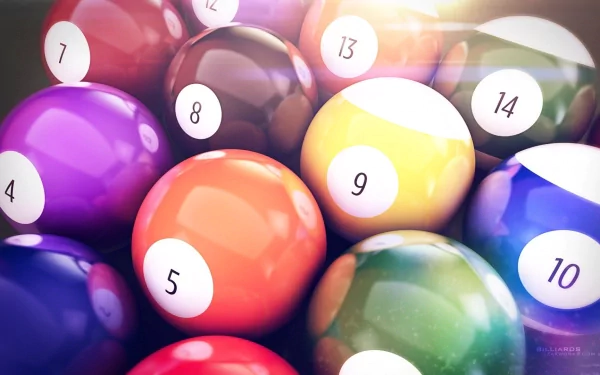 A vibrant collection of billiard balls, featuring numbers and various colors, arranged closely together. This HD image serves as a dynamic desktop wallpaper or background.