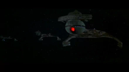 HD PC desktop wallpaper featuring a dark space scene from the movie Star Trek: The Motion Picture, showcasing iconic starships and a glowing red light.