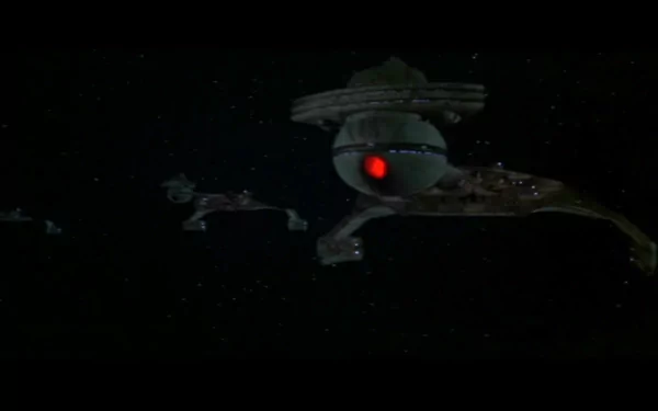 HD PC desktop wallpaper featuring a dark space scene from the movie Star Trek: The Motion Picture, showcasing iconic starships and a glowing red light.