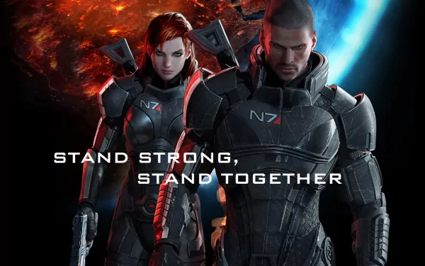 HD PC desktop wallpaper of Commander Shepard from the video game Mass Effect 3, featuring two armored characters against a cosmic background with the text Stand Strong, Stand Together.