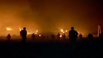 HD desktop wallpaper from the movie Full Metal Jacket showing silhouetted soldiers against a fiery, smoky battlefield backdrop.