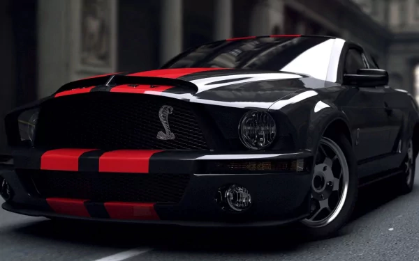 A striking Ford Mustang Shelby GT500 parked on a city street, showcasing its sleek design and distinctive red and black color scheme in high-definition detail.